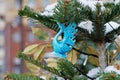 Blue ceramic swan as Christmas toy hanging on a Christmas tree at the Festival `Journey to Christmas` in Moscow