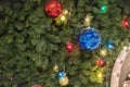 MOSCOW, RUSSIA - DECEMBER 06, 2017:Christmas tree background and Christmas decorations. Colorful balls and garland on green fir. Royalty Free Stock Photo