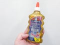 Moscow, Russia, December 2019: Close-up of a bottle of Elmer`s Golden glitter glue for making slime