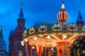 Moscow, Russia - December 2018: colorful carousel with numerous warm lights near Kremlin