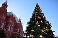 Moscow, Russia - December 16, 2018: Decorated Christmas tree and the State Historical Museum against the blue sky Royalty Free Stock Photo