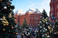 Moscow, Russia - December 16, 2018: Decorated Christmas trees against the State Historical Museum Royalty Free Stock Photo