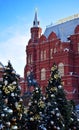 Moscow, Russia - December 16, 2018: Decorated Christmas trees against the State Historical Museum Royalty Free Stock Photo