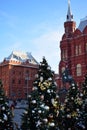 Moscow, Russia - December 16, 2018: Decorated Christmas trees against the State Historical Museum Royalty Free Stock Photo