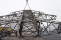 Moscow, Russia - December 21, 2017. The dismantling of the towers of high voltage lines in the city