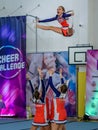 Moscow, Russia - December 22, 2019: Cheerleader girls perform a trick, jump very high, well-coordinated teamwork