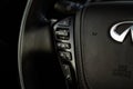 MOSCOW, RUSSIA - DECEMBER 11, 2021 Infiniti QX80 QX56 Call buttons on car steering wheel.