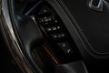 MOSCOW, RUSSIA - DECEMBER 11, 2021 Infiniti QX80 QX56 Volume and audio control buttons on the steering wheel.