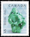 Postage stamp printed in Canada shows Mother and Child Inuit Sculpture, Cape Dorset, Christmas 1990, Native Art serie, circa Royalty Free Stock Photo