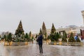 Moscow, Russia - December 20, 2018: Tourist take a picture of Christmas decorated Manezhnaya Square. Many christmas trees on Red