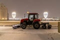 Moscow, Russia - December 7, 2022: Tractor Belarus cleans the street from snow Royalty Free Stock Photo