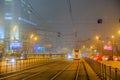 Moscow, Russia. December 26, 2019 A tram lit by a network of LEDs travels on rails in a foggy night. Environmentally friendly