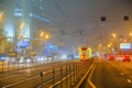 Moscow, Russia. December 26, 2019 A tram lit by a network of LEDs travels on rails in a foggy night. Environmentally friendly