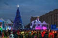 Moscow, Russia - December 2017: xmas tree, tents, garlands, ice sculptures, cloudy sky and crowd, Poklonnaya hill at winter.