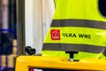 MOSCOW, RUSSIA - DECEMBER 16, 2020 YOLKA WMS badge on yellow signal vest close up view.