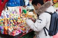 Moscow, Russia - December 21, 2017: Young Buyer Man Picks Toy Ru
