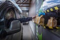 Moscow, Russia, 26/04/2020: The driver in the car receives an order in the McDonald`s window. A popular restaurant in the period