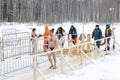 Moscow, Russia, 01/19/2019: Epiphany bathing in the ice hole in winter. Undressed people in ice water