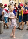 World cup 2018. People wearing colorful clothes. Woman doing photo at funny pose.