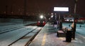 Moscow, Russia - february 16 2021: The arriving train of the Moscow Central Diameters and its bright spotlight