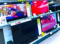 Big UHD Smart TVs, shows the demo picture in an electronic shop Royalty Free Stock Photo