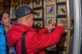 Moscow, Russia - February 25, 2017: A couple of visitors are examining a stand with dried butterflies and beetles