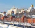 Embankment of the Moscow river, view of the Kremlin wall, towers and churches on the territory of the Moscow Kremlin in winter, on