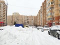 Moscow, Russia - 14 February 2021: Heavy snowfall paralyzed the movement of cars in the city. The car is covered in snow