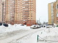 Moscow, Russia - 14 February 2021: Heavy snowfall paralyzed the movement of cars in the city. The car is covered in snow