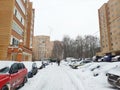 Moscow, Russia - 14 February 2021: Heavy snowfall paralyzed the movement of cars in the city. The car is covered in snow