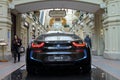 Luxury BMW i8 hybrid electric coupe on sale at the State Department Store in Moscow. Back view.