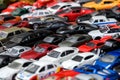 Moscow, Russia, February 2020. A mix of miniature toy cars. Lots of small toy car models, mess, top view. Background of toy cars