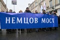 Demonstrators carrying a big banner: Nemtsov Bridge on the Nemtsov memory march in Moscow