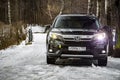 MOSCOW, RUSSIA - FEBRUARY 2, 2020: New Honda SUV Pilot 3 Generation Black in winter off-road. LED head light optics included. Royalty Free Stock Photo