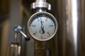 MOSCOW, RUSSIA. 07 February 2018: Pressure gauge manometer, valves and pipes made of white metal Royalty Free Stock Photo