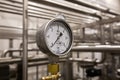 MOSCOW, RUSSIA. 07 February 2018: Pressure gauge manometer, valves and pipes made of white metal Royalty Free Stock Photo