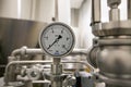 MOSCOW, RUSSIA. 07 February 2018: Pressure gauge manometer, valves and pipes made of white metal Royalty Free Stock Photo