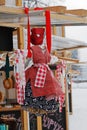 Russian Shrovetide small doll in traditional colorful dress at Russian national festival `Shrove` in Gorky Park in Moscow