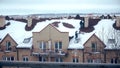 MOSCOW, RUSSIA - FEBRUARY, 20, 2017. Shoveling snow from the sloped roof after heavy snowfall