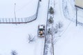 Moscow, Russia - February 14, 2021: Tractor cleans snow on the road after heavy snowfall in residential area in Moscow Royalty Free Stock Photo