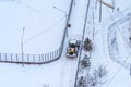 Moscow, Russia - February 14, 2021: Tractor cleans snow on the road after heavy snowfall in residential area in Moscow Royalty Free Stock Photo