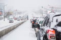Moscow, Russia - February, 2018: Traffic jam on Moscow road during blizzard snowstorm