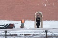 A utility worker cleans snow with a snowplow at the grave of the Unknown Soldier in the Kremlin during a snowfall Royalty Free Stock Photo