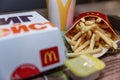 Moscow, Russia, 26/03/2020: Food from McDonald`s on a tray. French fries, hamburger, sauce and drink. Close-up