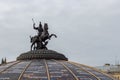 12-10-2019, Moscow, Russia. George the Victorious on a horse kills a dragon snake. Coat of arms of Moscow on a glass dome