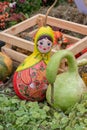 12-10-2019, Moscow, Russia. Golden Autumn harvest festival. Bottle pumpkin painted with matrioshka paints. Pumpkin Matryoshka Royalty Free Stock Photo