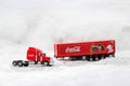 Moscow, Russia - January 02, 2019: Coca-Cola Christmas truck. A toy in red color rides in the real snow drifts. Outdoors, new year Royalty Free Stock Photo