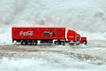 Moscow, Russia - January 02, 2019: Coca-Cola Christmas truck. A toy in red color rides in the real snow drifts. Outdoors, new year Royalty Free Stock Photo