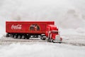 Moscow, Russia - January 02, 2019: Coca-Cola Christmas truck. A toy in red color rides in the real snow drifts. Outdoors, new year Royalty Free Stock Photo