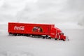 Moscow, Russia - January 02, 2019: Coca-Cola Christmas truck. A toy in red color rides in the real snow drifts. Outdoors, new year Royalty Free Stock Photo